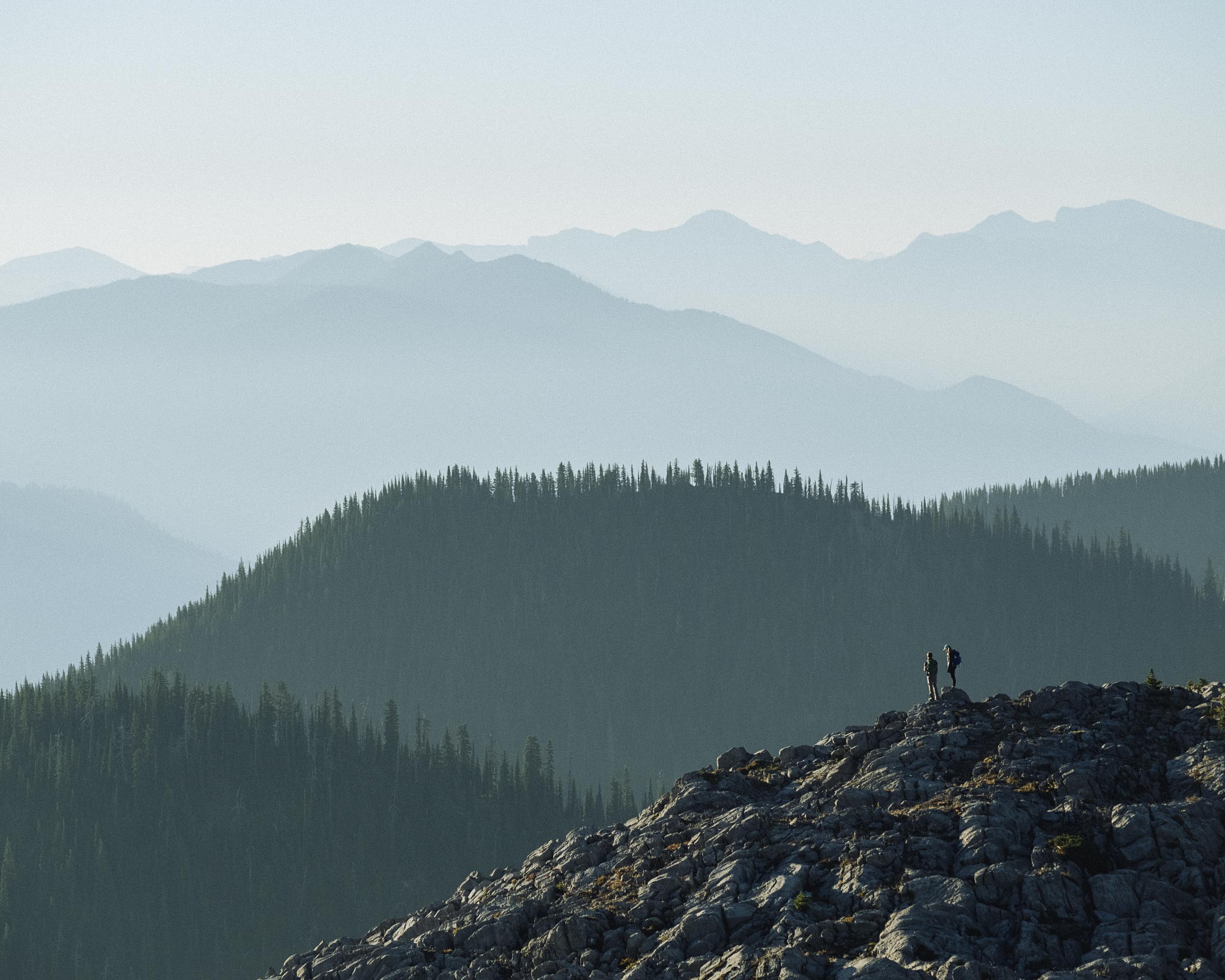 Hiking in the hazy mountain layers above Fernie, BC