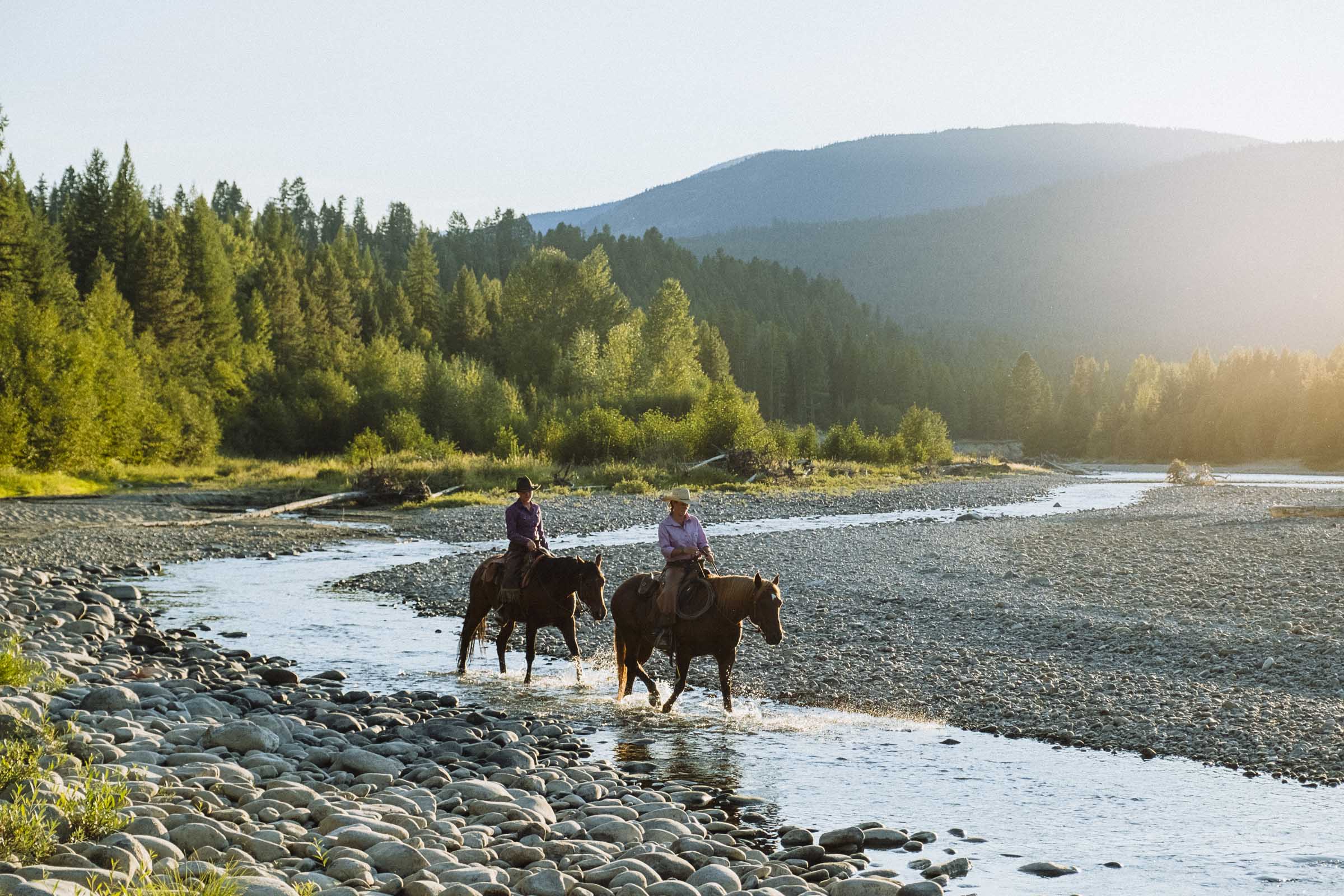 Riding horses down by St Mary's River, Three Bars Ranch, Cranbrook BC