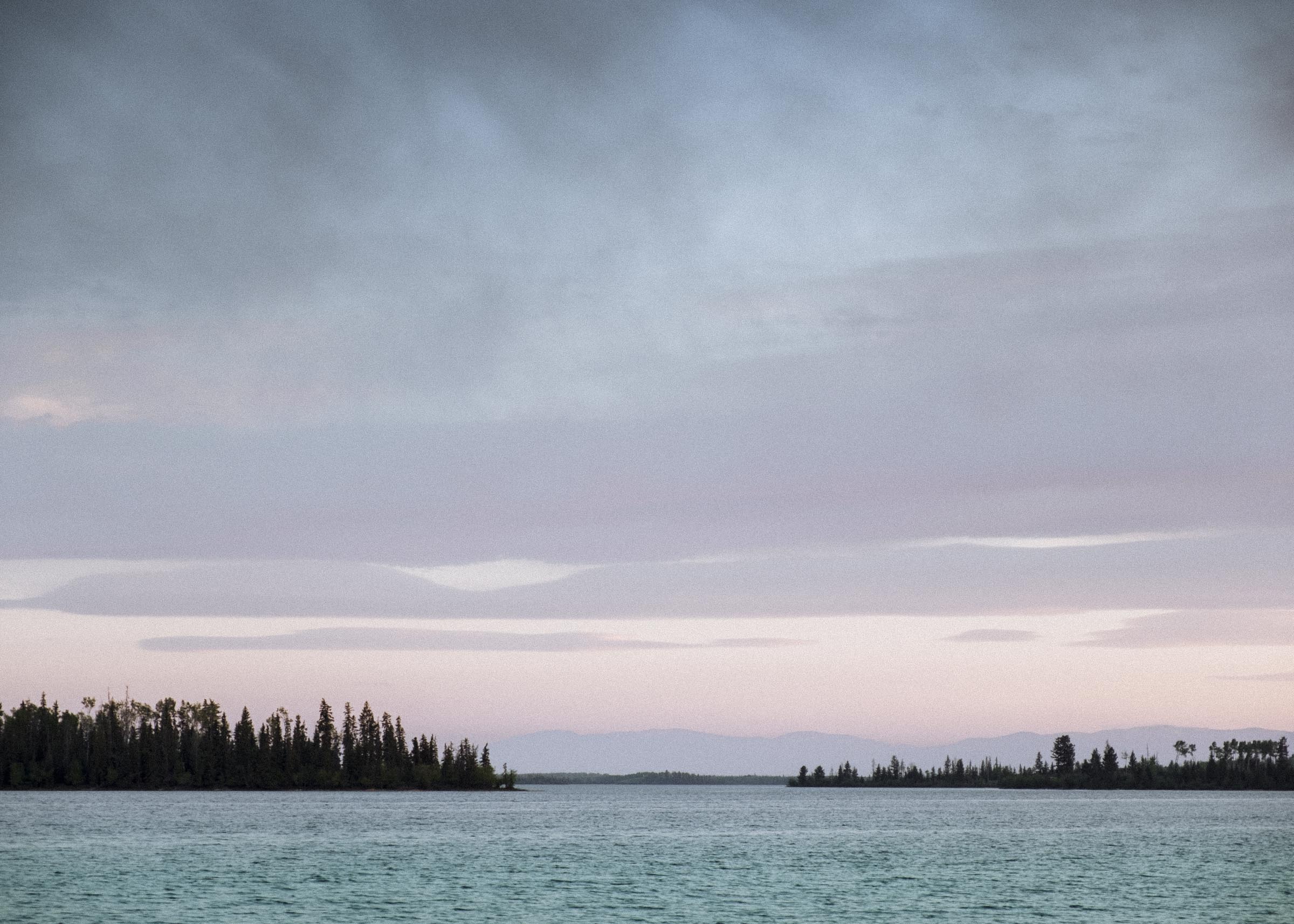 Clouds rolling in on a subtle sunset on Green Lake, BC