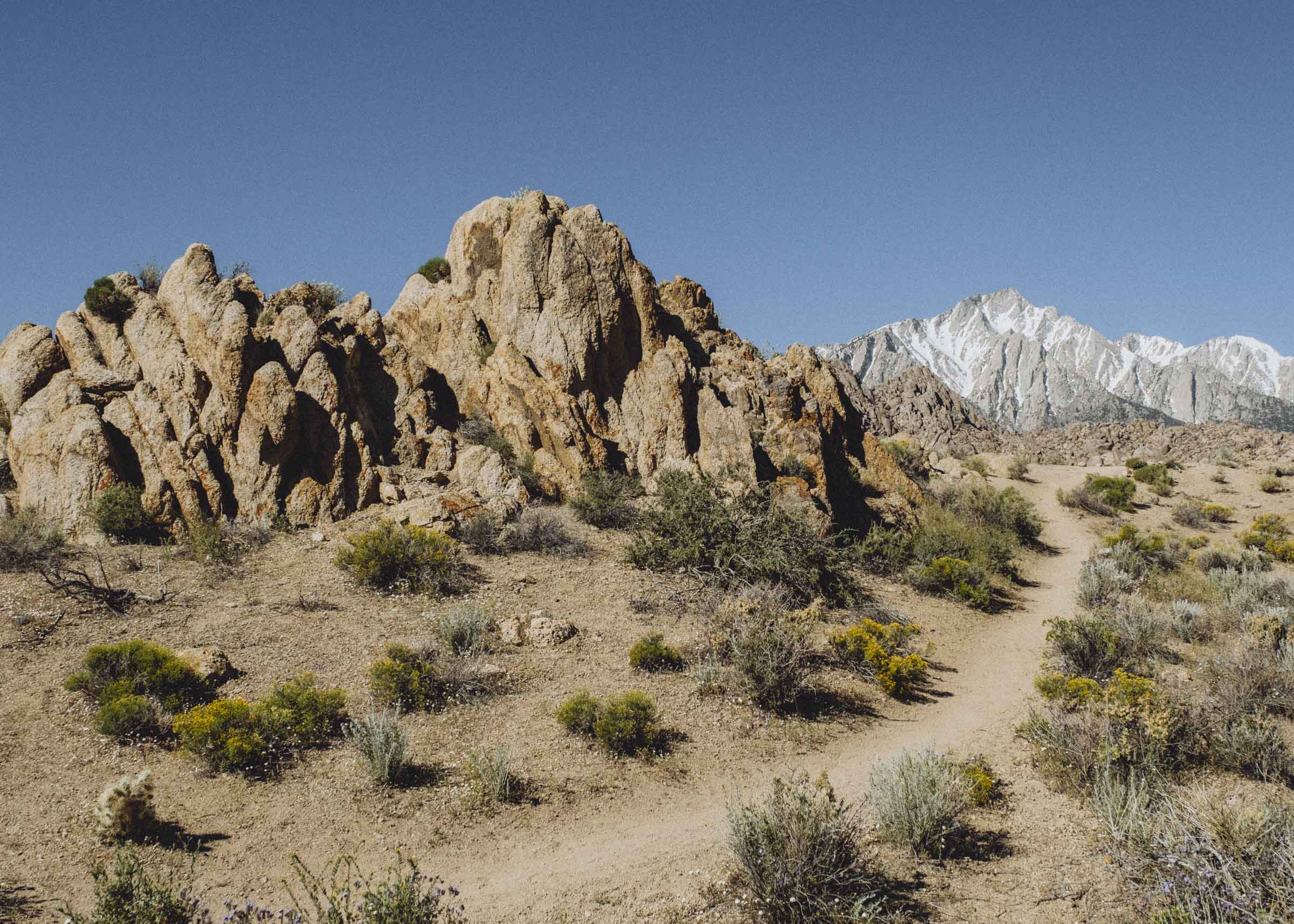 Strolling the trails through the weathered rocks of the Alabama Hills, CA
